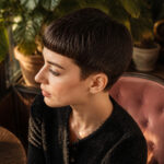 Anne Hathaway with a 1960s-inspired pixie cut and blunt fringe.