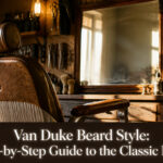 Model with a classic Van Dyke beard in a stylish environment.